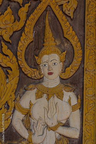 Thai carve on wooden board door style   in the temple at Norther