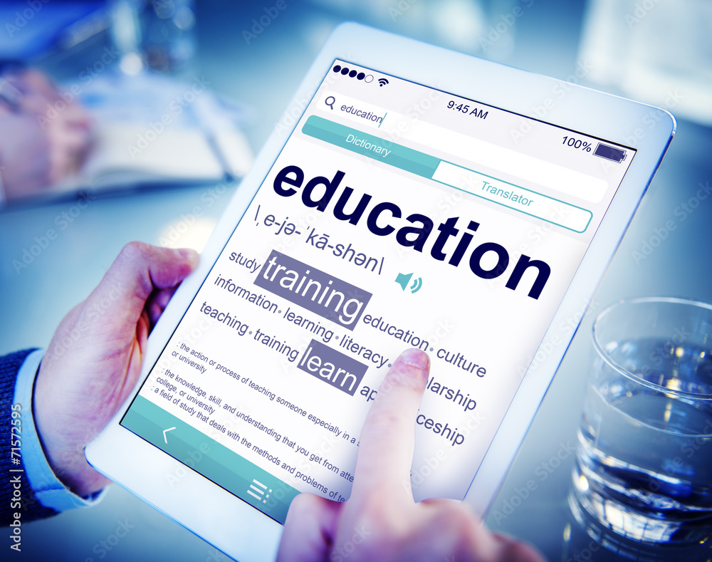 Man Reading the Definition of Education Man Reading the Definition of Education