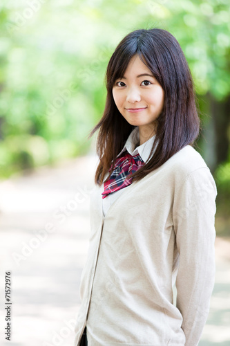 portrait of young asian student in the park