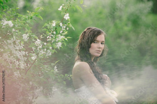 the girl with a bouquet of wild flowers in cloudy weather 2