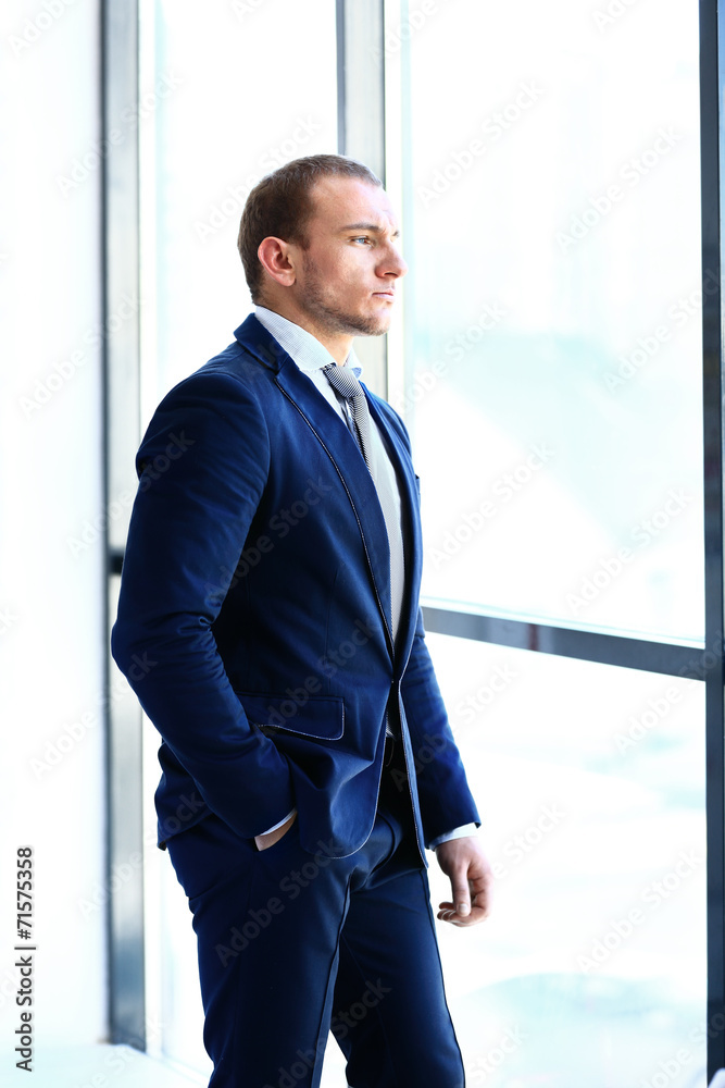 man looking on city through the window man looking on city through the window