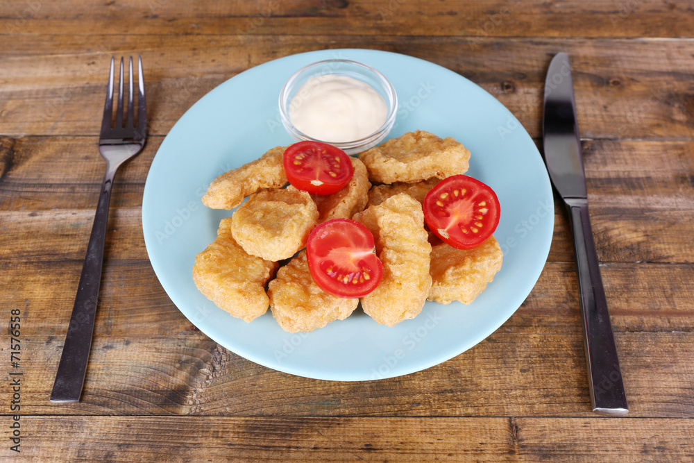 Chicken nuggets with sauce on table close-up Chicken nuggets with sauce on table close-up