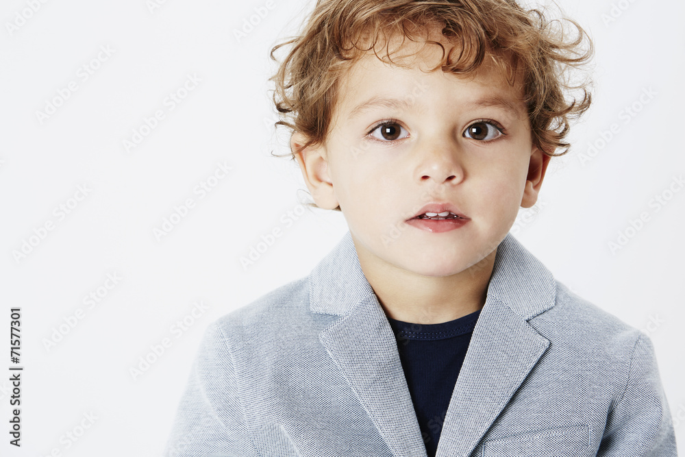 Smart young boy in suit jacket, portrait Smart young boy in suit jacket, portrait
