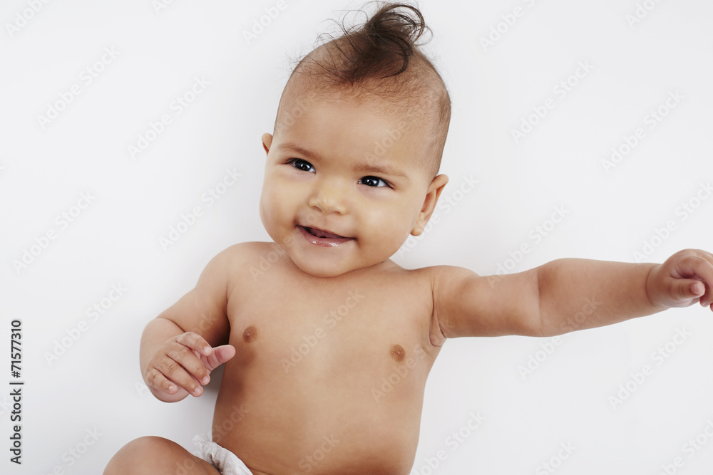 Cheeky six month old baby girl with Mohican hairstyle Cheeky six month old baby girl with Mohican hairstyle