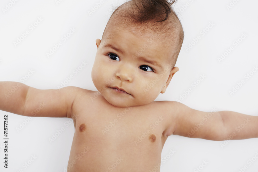 Cheeky six month old baby girl with Mohican hairstyle Cheeky six month old baby girl with Mohican hairstyle