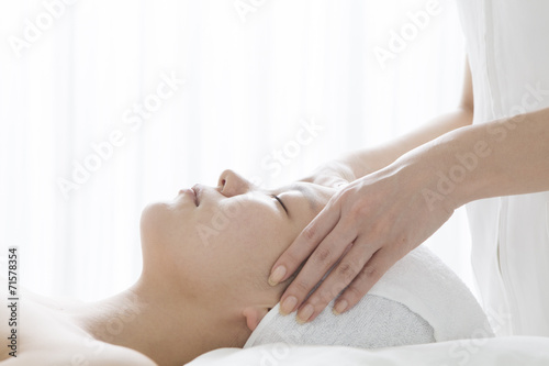 Women undergoing facial massage