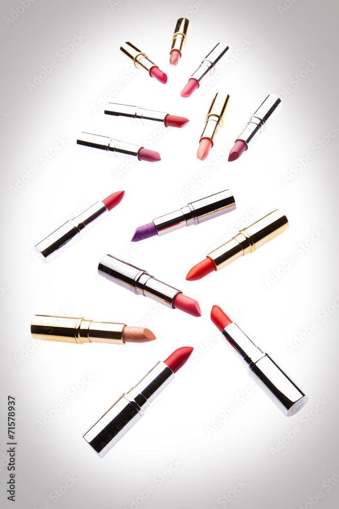 Different-colored lipsticks on white background Different-colored lipsticks on white background