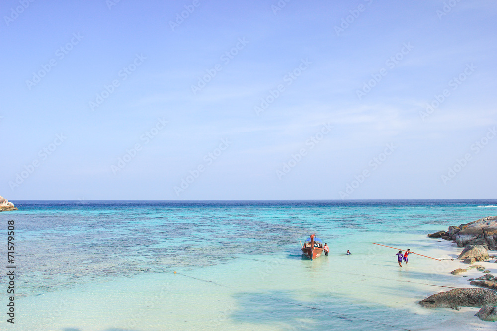 Fisherman sailed longtail boat on the beach - Lipe island Thaila Fisherman sailed longtail boat on the beach - Lipe island Thaila