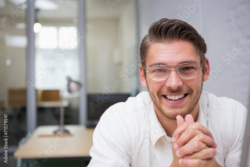 Cheerful young businessman at office