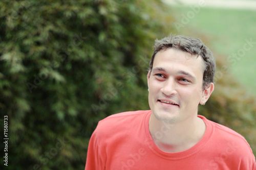  young man relaxing in a park