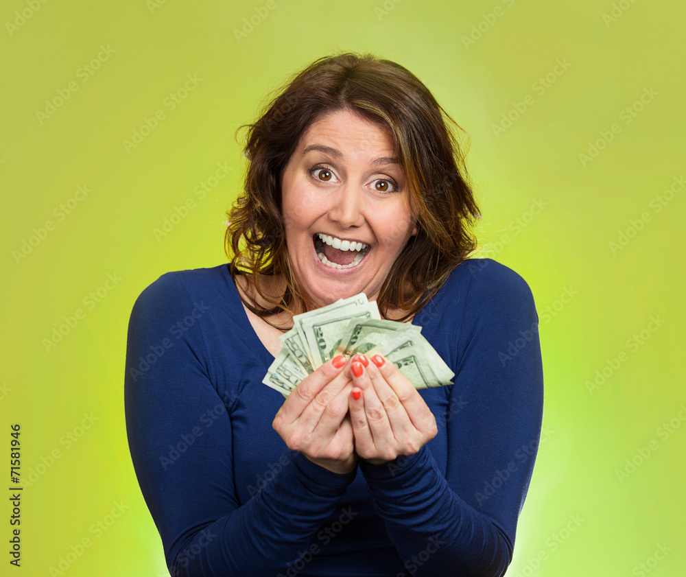 excited business woman holding money on green background excited business woman holding money on green background