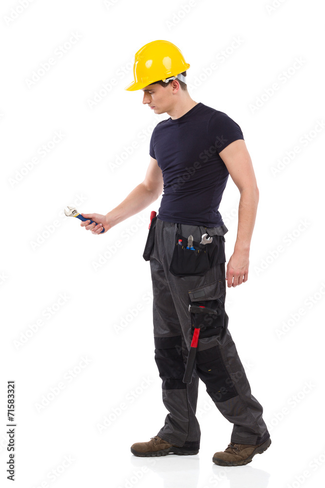 Manual worker using a wrench Manual worker using a wrench