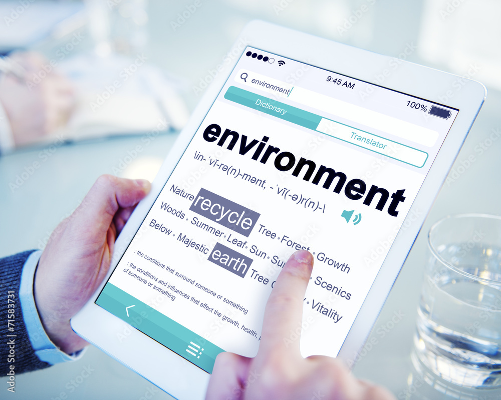 Man Reading the Definition of Environment Man Reading the Definition of Environment