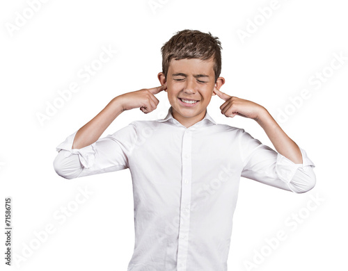 annoyed young man plugging closing ears on white background 