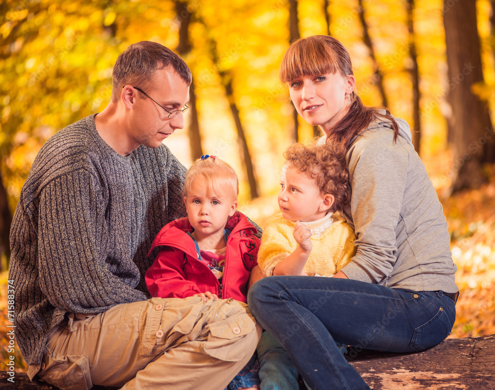parents with two little girls at fall forest parents with two little girls at fall forest