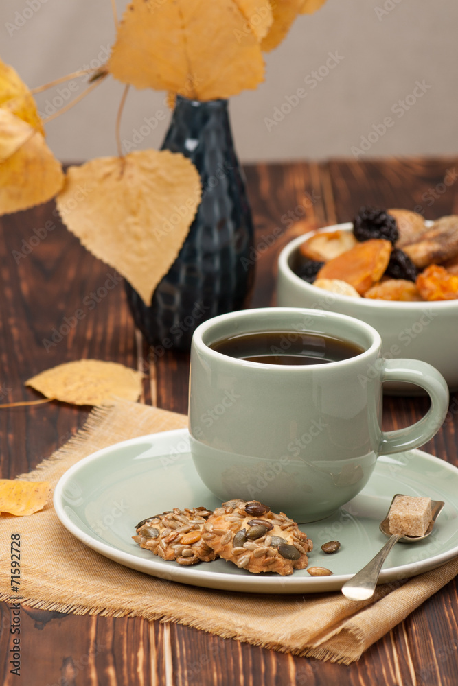 Fototapeta premium Autumn Concept. Cup Of Tea Or Coffee. Dried Fruits. Cookies With