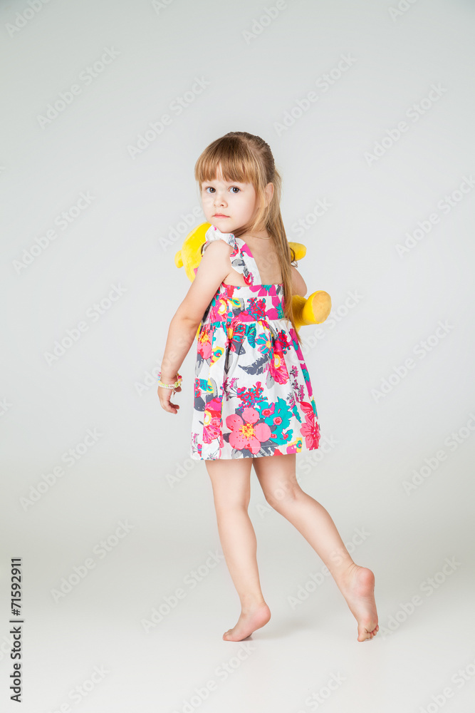 Little fashion girl in beautiful dress posing Little fashion girl in beautiful dress posing