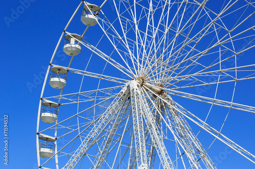 Ferris wheel isolated against blue