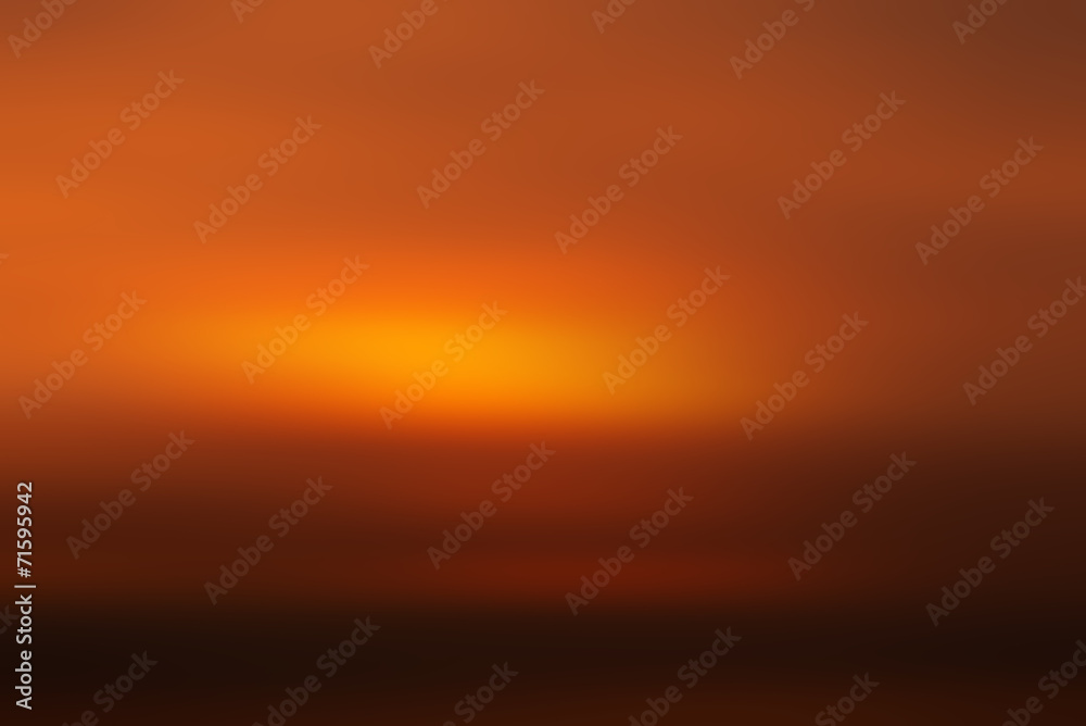 Blur of Gradient Orange and Dark Tone background