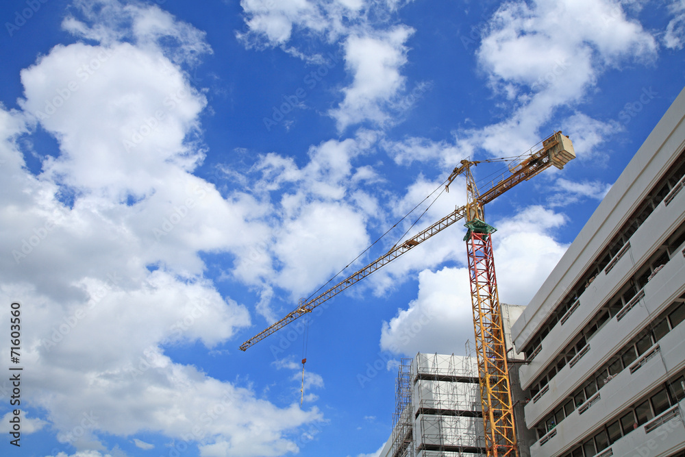 Yellow crane at construction site