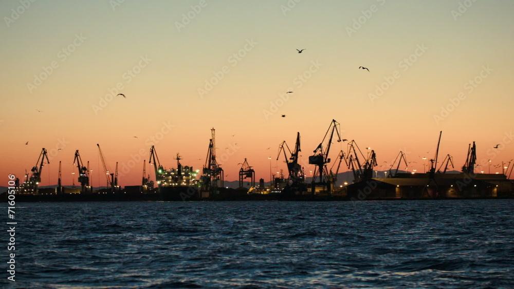 Dock with cranes in the evening Dock with cranes in the evening