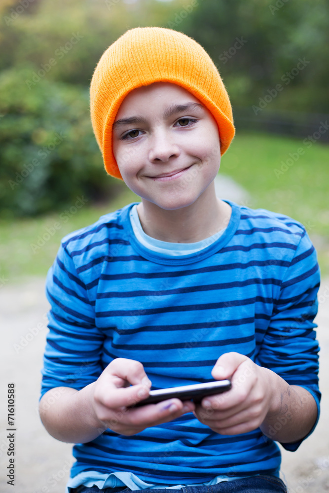 boy playing on phone boy playing on phone