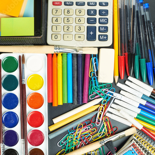 Desk covered with multiple stationery