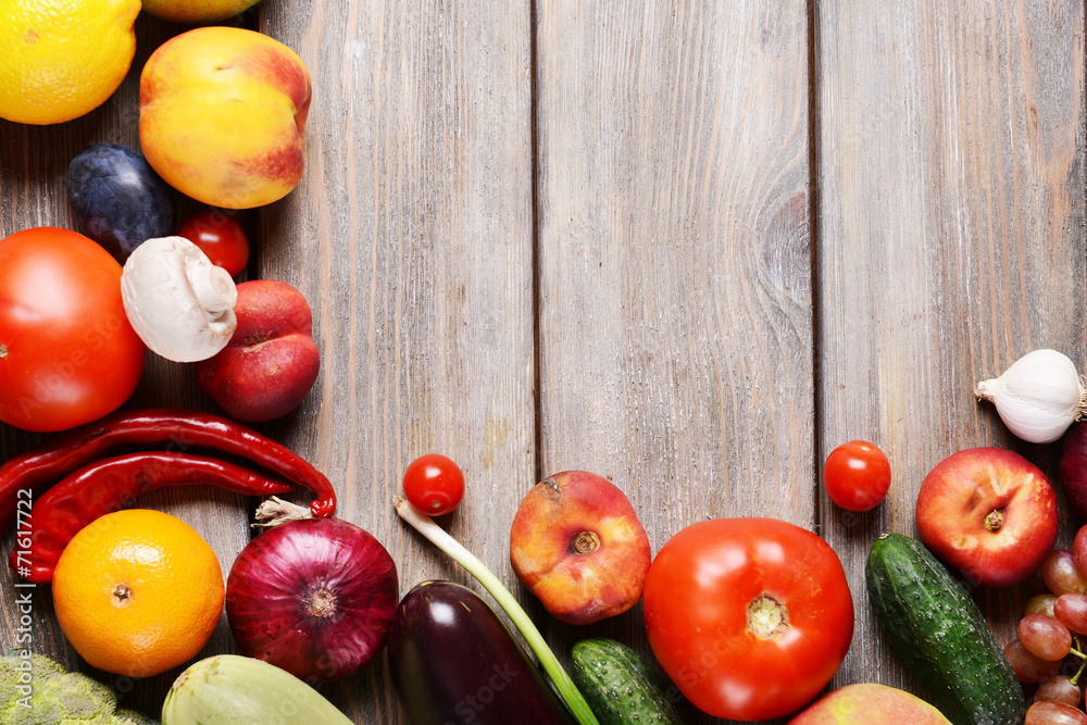 Fresh organic fruits and vegetables on wooden background Fresh organic fruits and vegetables on wooden background