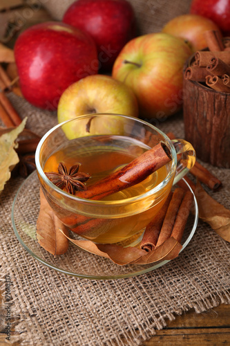 Composition of  apple cider with cinnamon sticks  fresh apples