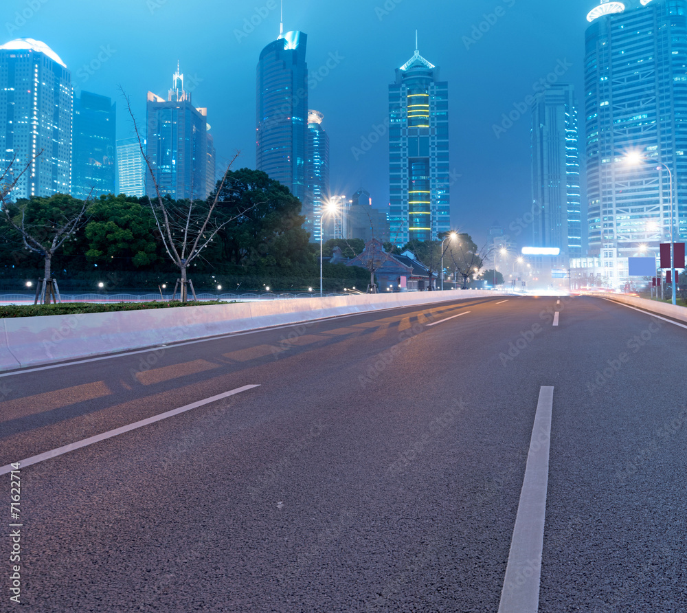 Asphalt road and modern city Asphalt road and modern city