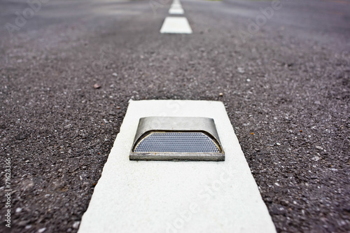 Billede på lærred road stud with white reflector