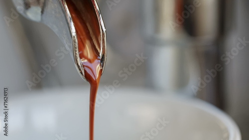 closeup video of exctraction process from espresso machine, made photo