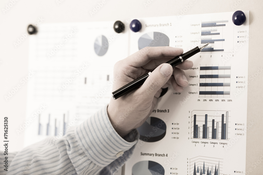 Businessman analyzing investment charts with laptop. Accounting Businessman analyzing investment charts with laptop. Accounting