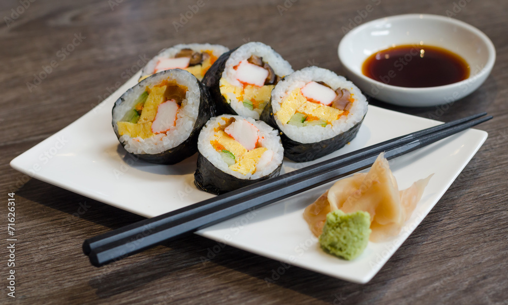 Sushi roll with ginger and wasabi Sushi roll with ginger and wasabi