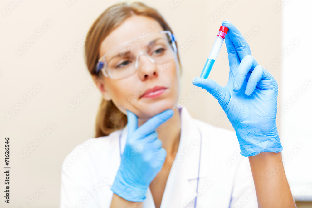 Young scientist working with samples in lab. Young scientist working with samples in lab.