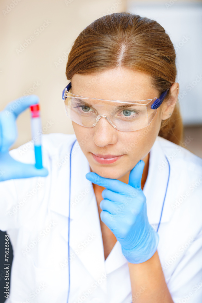 Young scientist working with samples in lab. Young scientist working with samples in lab.