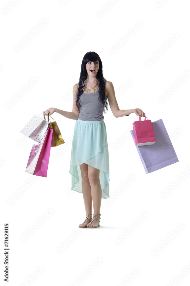 Young happy shopper girl with surpirsed facial expression