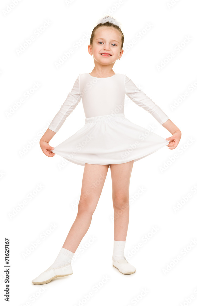little girl dancing in a white ball gown