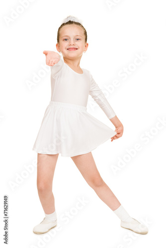 little girl dancing in a white ball gown
