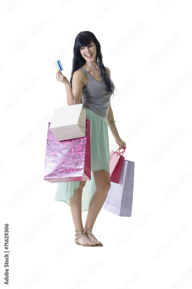 Young happy shopper presenting banking card for purchases