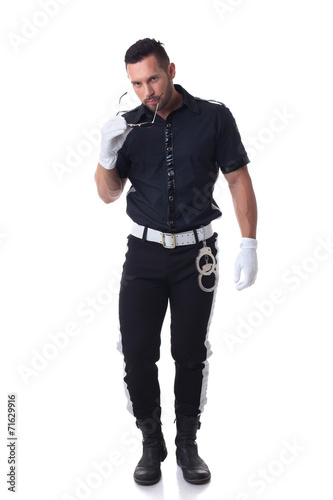 Trendy cop posing at camera, isolated on white