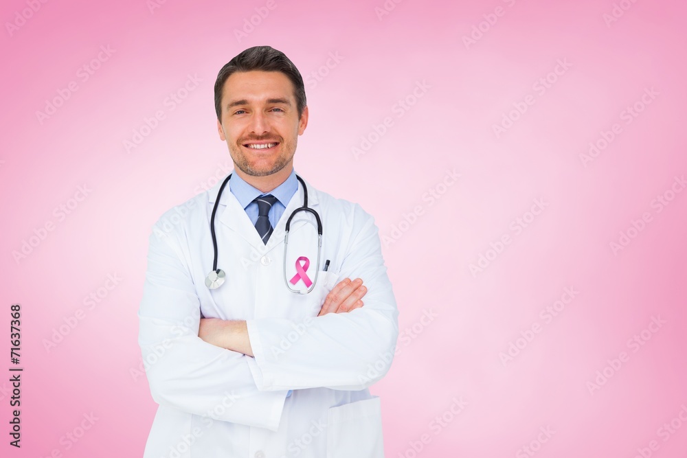 Composite image of handsome young doctor with arms crossed Composite image of handsome young doctor with arms crossed