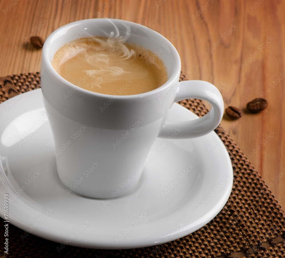 Cup of espresso coffee on a wooden table Cup of espresso coffee on a wooden table