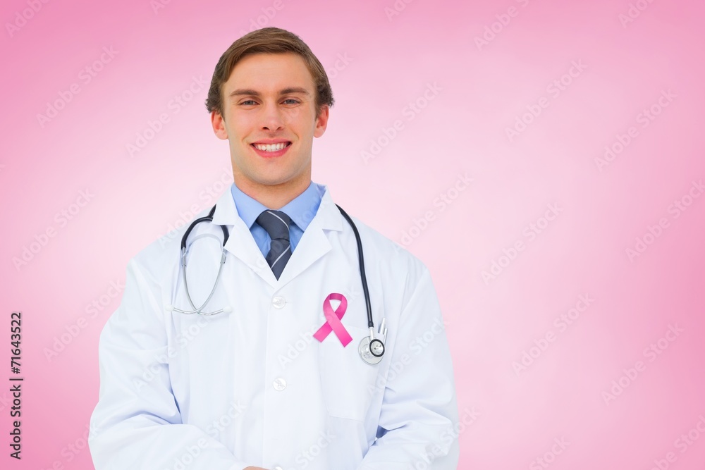 Composite image of young doctor using tablet pc Composite image of young doctor using tablet pc