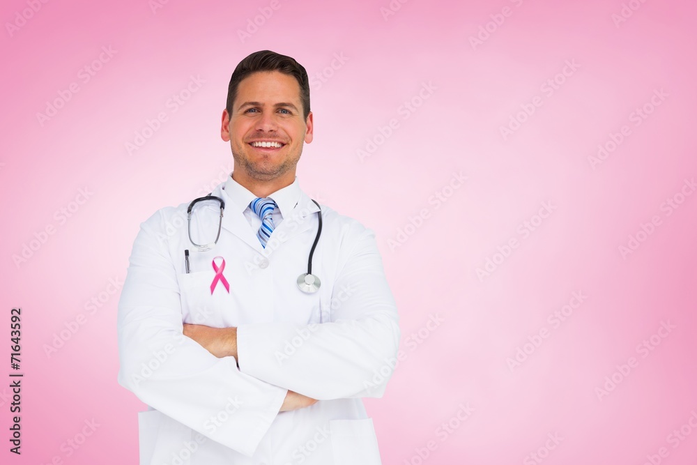Composite image of handsome doctor with arms crossed Composite image of handsome doctor with arms crossed