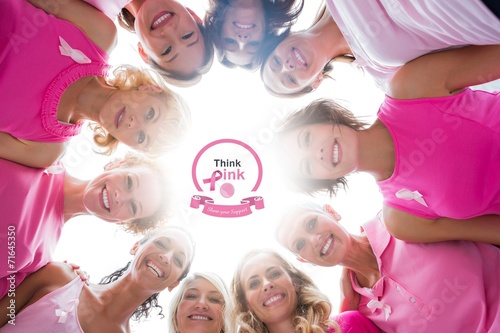 Women in circle wearing pink for breast cancer