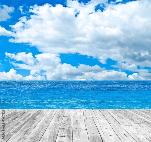 Tropical sea and wooden floor background