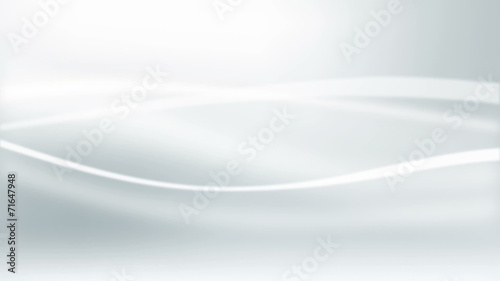 Abstract white waves in motion on light grey background