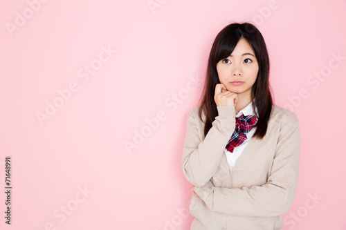 young asian woman on pink background