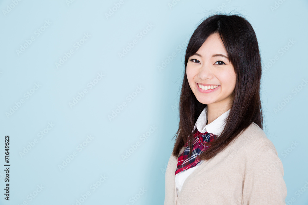 young asian woman on blue background young asian woman on blue background